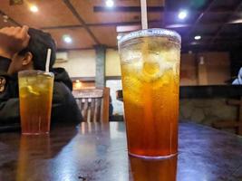 a close up of fresh iced tea in glass photo