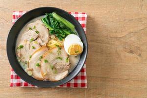 Ramen noodles in pork bone soup with roast pork and egg photo