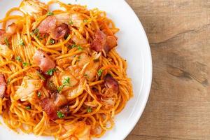 stir-fried spaghetti with kimchi and bacon photo