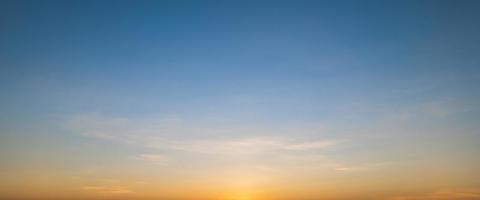 Morning sky scene with a bright golden light. Beautiful sunrise with clouds soft. Nature background concept photo