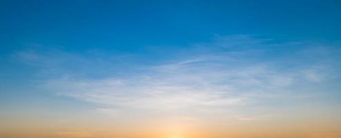 Morning sky scene with a bright golden light. Beautiful sunrise with clouds soft. Nature background concept photo