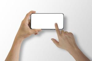 Close up of hand holding smartphone with white screen, Isolated on white background. photo