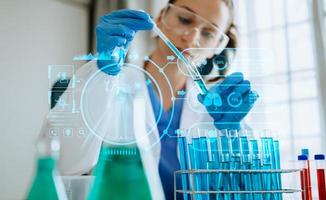 DNA molecule testing concepts. The doctor in a mask examines DNA molecules on the chemical laboratory with vr icon photo