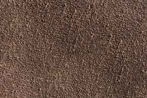 Background macro texture of suede brown leather. photo