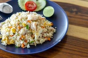 Seafood fried rice with prawns and squid, a popular Thai dish with a copy space. photo