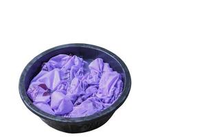Soak dirty clothes in the basin black for cleansing  isolated on white background and clipping path photo