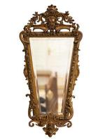 Antique mirror in a bronze frame on a white background. photo