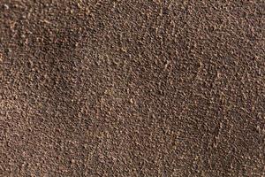 Background macro texture of suede brown leather. photo