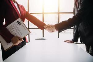 Close up view of job interview in office, focus on resume writing tips, employer reviewing good cv of prepared skilled applicant, recruiter considering application, hr manager making hiring decision photo