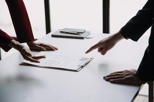Close up view of job interview in office, focus on resume writing tips, employer reviewing good cv of prepared skilled applicant, recruiter considering application, hr manager making hiring decision photo