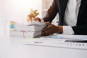 Close up view of job interview in office, focus on resume writing tips, employer reviewing good cv of prepared skilled applicant, recruiter considering application, hr manager making hiring decision photo