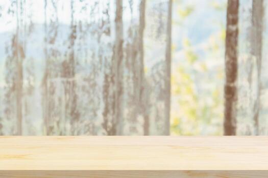 Empty wood table top with window curtain abstract blur background for product display photo