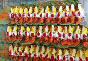 Banarasi pan, betel nut garnished with all indian banarasi ingredients for sale. photo