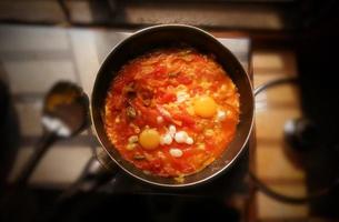 Tomato and egg curry, a traditional tasty food in Bangladesh. Bangladeshi or Indian Style Egg tomato Curry Recipe close-up photo