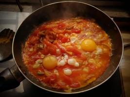 Tomato and egg curry, a traditional tasty food in Bangladesh. Bangladeshi or Indian Style Egg tomato Curry Recipe close-up photo