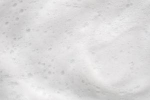 Abstract white soap foam bubbles texture background photo