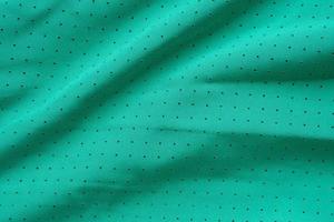 Green sports clothing fabric football shirt jersey texture background photo