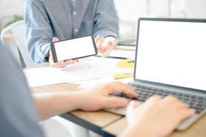 Mockup image of engineers using laptop to drawing design building Project in office, mockup concept photo