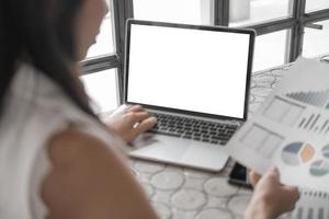 Mockup image of close up business woman working with smartphone laptop and documents in office, mockup concept photo