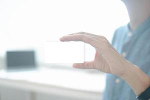 Mockup image of engineers showing business card in office, mockup concept photo