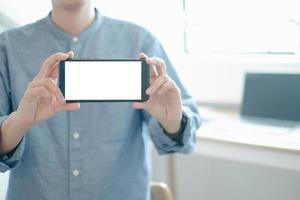 Mockup image of engineers showing smartphone design building Project in office, mockup concept photo