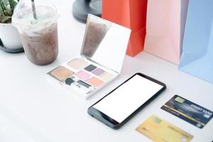 Mockup image of Coffee cafe white table with mobile and credit card, mockup concept photo