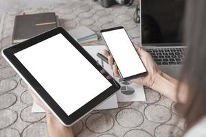 Mockup image of close up business woman working with smartphone tablet and documents in office, mockup concept photo