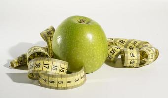 Apple and measuring tape, Diet. photo