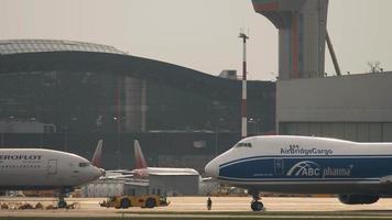 MOSCOW, RUSSIAN FEDERATION JULY 29, 2021 - Boeing 747 Airbridgecargo and Boeing 777 Aeroflot at Sheremetyevo Airport SVO. Airbus A320 Aeroflot taxis in the background video