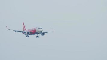 PHUKET, THAILAND NOVEMBER 29, 2019 - Air Asia Airbus A320 200 9M AJK landing at Phuket International airport video