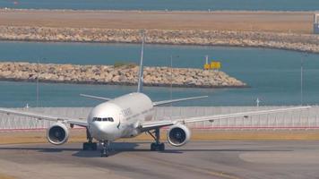 HONG KONG NOVEMBER 10, 2019 - Cathay Pacific Boeing 777 turn runway before departure from Chek Lap Kok International Airport, Hong Kong,. video