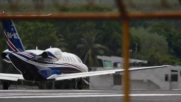 PHUKET, THAILAND DECEMBER 05, 2016 - Plane of HS MCL, Mjet taxiing for takeoff at Phuket airpor. MJets is a business jet charter airline based in Thailand. video