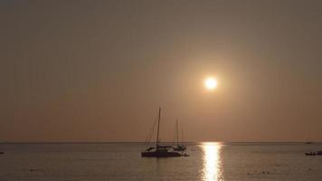 Timelapse of sunset over ocean landscape, Nai Harn beach, Phuket, Thailand video