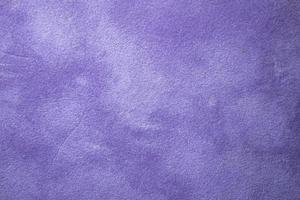 Bright violet texture or background of smooth fabric material photo