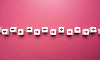 Blocks with arrows go in a chain. Movement in one direction. Set course, make your way. Moving forward, step by step. Motivation, self-development. Strategic planning. photo