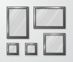 Collection of photo frames on the gray wall. Modern empty frame template with transparent glass and shadow. Vector