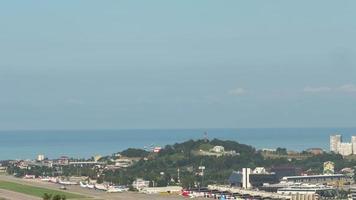 SOCHI, RUSSIA JULY 29, 2022 - Time lapse footage of the airfield at Sochi airport, sea background video