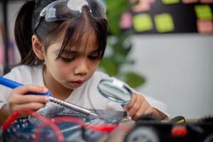 Asia students learn at home in coding robot cars and electronic board cables in STEM, STEAM, photo