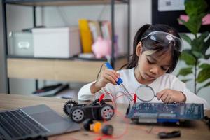 Asia students learn at home in coding robot cars and electronic board cables in STEM, STEAM, photo