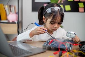 Asia students learn at home in coding robot cars and electronic board cables in STEM, STEAM, photo