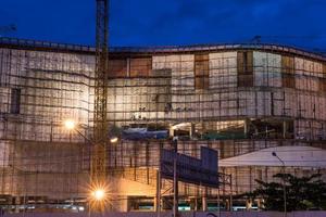 Construction site with cranes in twilight time photo