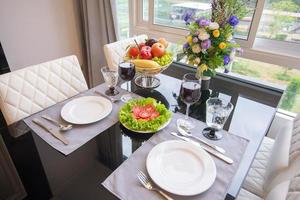 The table set and a glass of wine photo