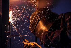 Arc welding of a steel in construction site photo