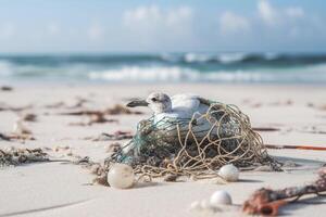 Bird, seagull trapped in plastic garbage lying on the beach. The concept of an ecological disaster caused by plastic garbage. photo