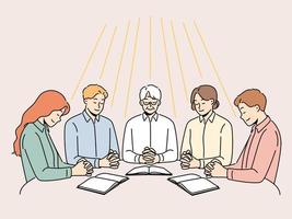 Group of diverse people sit at table praying together. Men and women engaged in prayer ask god for fate and fortune. Faith and religion. Vector illustration.