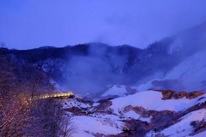 Noboribetsu Hell Valley in Winter at Night where is a Famous Tourist Attraction in Hokkaido, Japan. photo