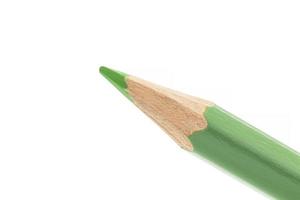 green wooden pencil isolated on white background photo