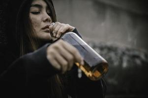 Portrait of addict drug asian woman,alcoholic woman concept photo