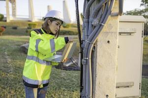 Environmental engineers inspect water quality,Bring water to the lab for testing,Check the mineral content in water and soil,Check for contaminants in water sources. photo