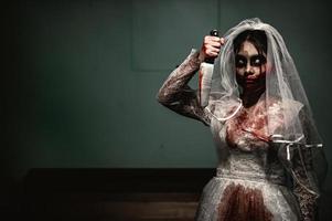 Halloween festival concept,Asian woman makeup ghost face,Bride zombie charactor,Horror movie wallpaper or poster photo